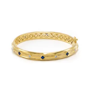Brazalete cerrado zirconias azul - chapa de oro 14k
